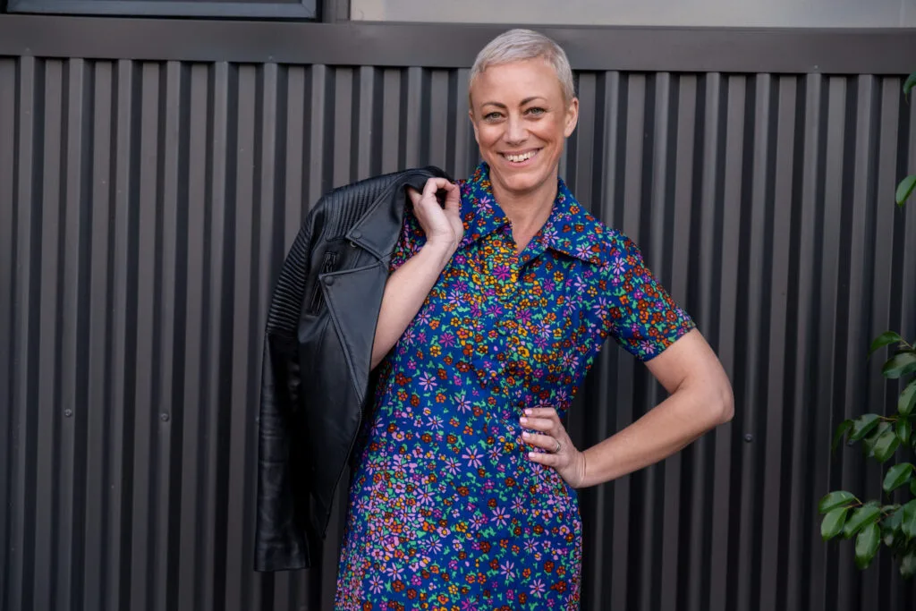 Kiah Bouchet smiling in a leather jacket