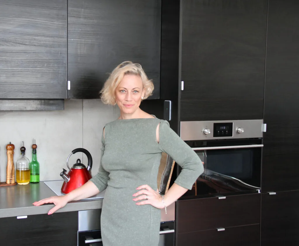 Kiah Bouchet standing in a tidy, organised modern kitchen in Perth